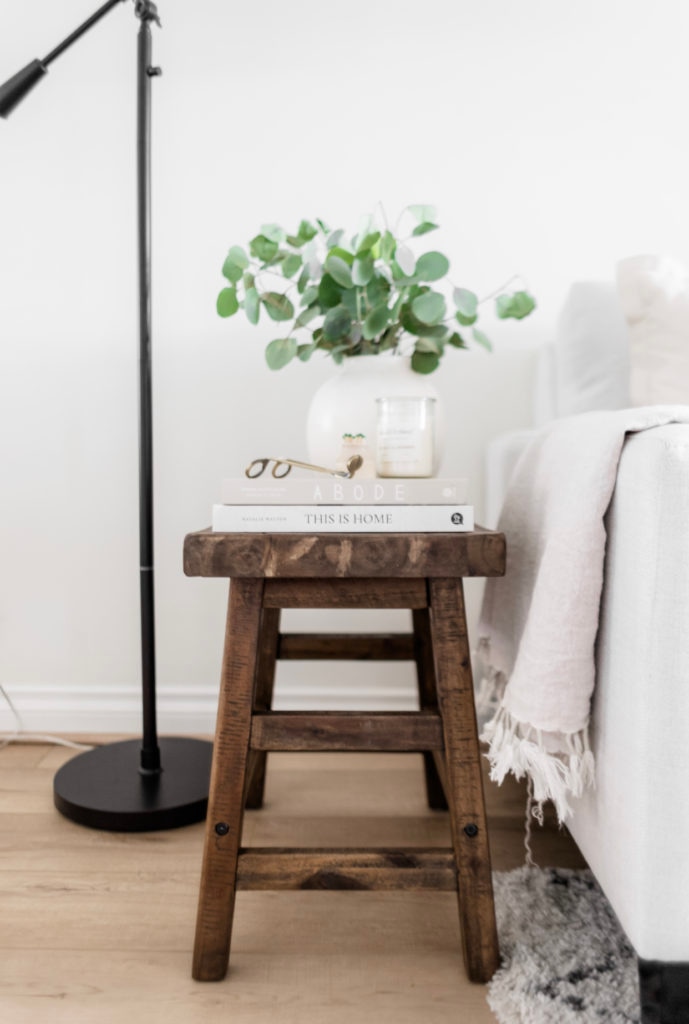 Five Uses For An Accent Stool - Halfway Wholeistic; Click here to see the accent stools on Halfway Wholeistic! Vintage-look accent stools seem to be all the rage these days. I love both the look and versatility of them. Whether you’re looking to add seating, an accent table, or a nightstand, a stool is the perfect addition to nearly any space! Stools for kitchen island with back wood. Stool design wooden modern. Stools for living room extra seating. Kitchen stools with backs modern. Stools in front of fireplace.