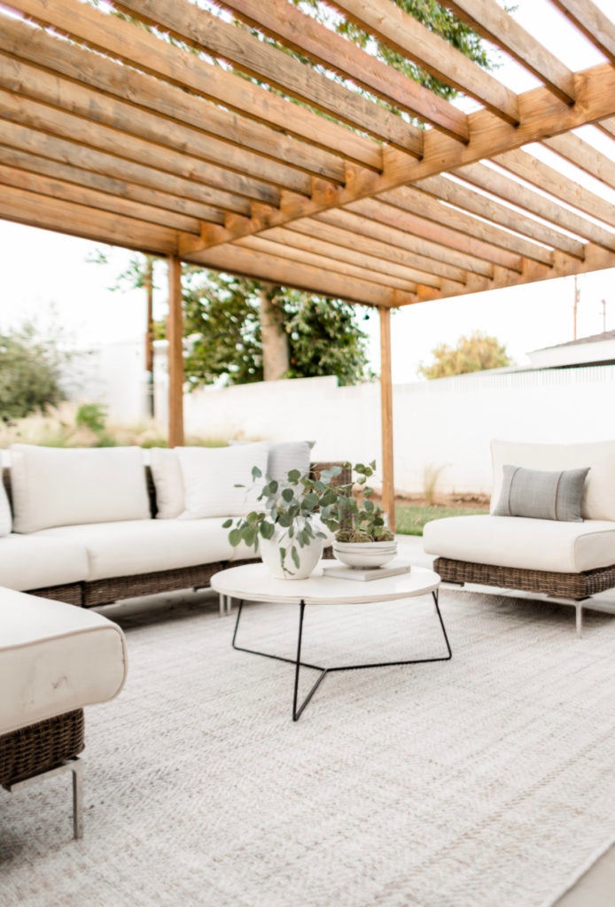 Our Backyard Patio Details - Halfway Wholeistic; Click to see backyard patio on Halfway Wholeistic! We renovated our backyard a few years ago by adding a new stucco wall, wood pergola, concrete patio and fresh landscaping! Backyard landscaping designs layout outdoor living. Backyard patio designs layout landscapes. Backyard patio ideas outdoor areas decks. Backyard patio designs layout landscapes. Patio ideas on a budget backyard wood. Patio ideas decorating back porches. Backyard patio decorating ideas back porches. 