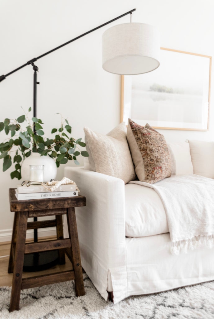 Living Room Update: World Market Sofa Reveal - Halfway Wholeistic; Click to see this living room update on Halfway Wholeistic! Our ivory sofa from World Market arrived & it's as pretty in person as online! The color is creamy white. The polyester-nylon upholstery is great! Living room decor ideas modern luxury. Living room ideas cozy warm rustic. Living room furniture arrangement ideas with fireplace and tv. Living room ideas modern contemporary luxury. Living room furniture sets couch. Couch pillow arrangement color combos. 