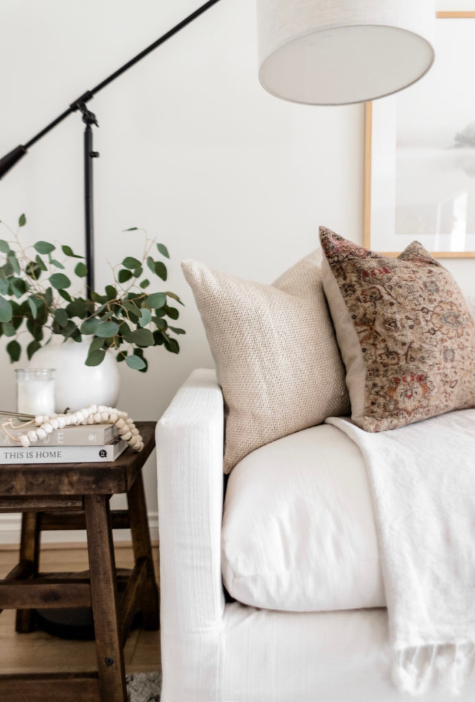 Living Room Update: World Market Sofa Reveal - Halfway Wholeistic; Click to see this living room update on Halfway Wholeistic! Our ivory sofa from World Market arrived & it's as pretty in person as online! The color is creamy white. The polyester-nylon upholstery is great! Living room decor ideas modern luxury. Living room ideas cozy warm rustic. Living room furniture arrangement ideas with fireplace and tv. Living room ideas modern contemporary luxury. Living room furniture sets couch. Couch pillow arrangement color combos. 